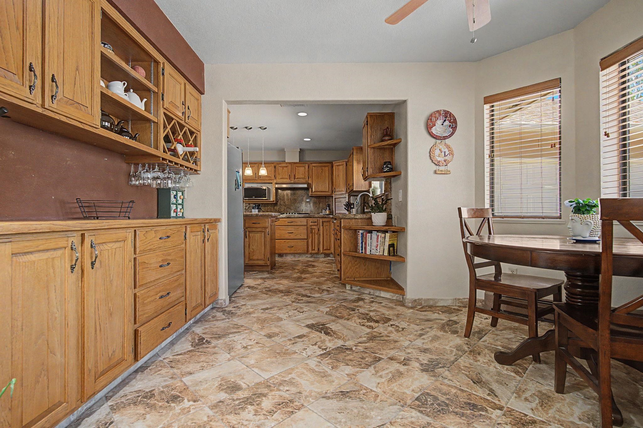 539 1/2 Ridgestone Court Grand Junction, CO 81507 - Photo 3 of 31 a kitchen with white cabinets and sink