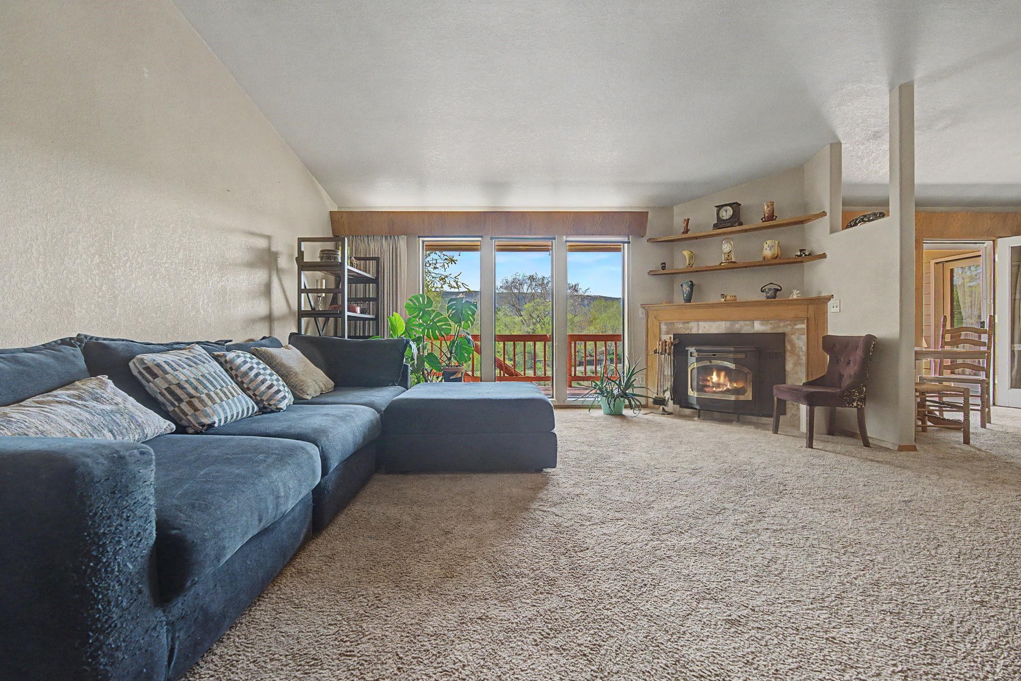 539 1/2 Ridgestone Court Grand Junction, CO 81507 - Photo 10 of 31 a living room with furniture and a fireplace