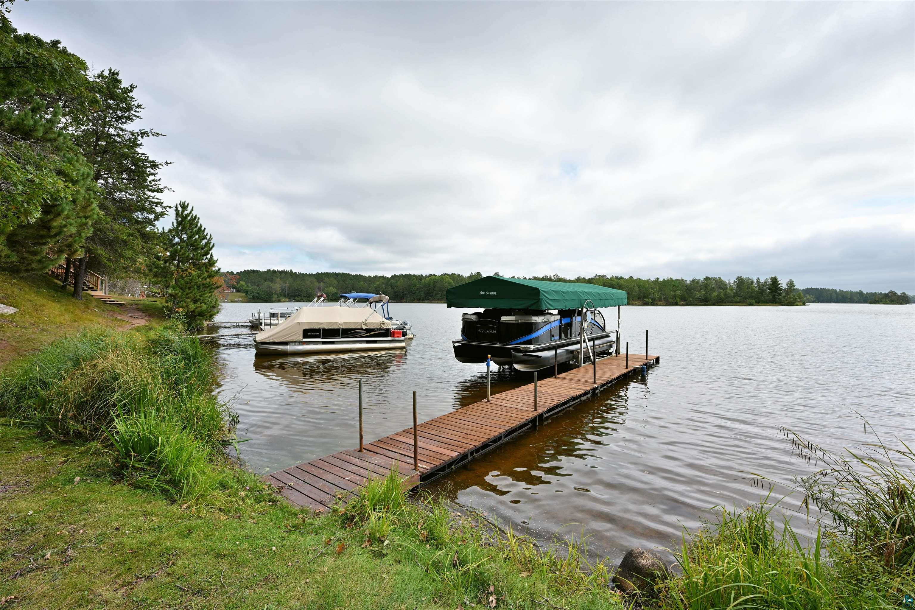 6833 View Point Lodge Road, Unit 13 Gordon, WI 54838 - Photo 24 of 32 Dock featuring a water view