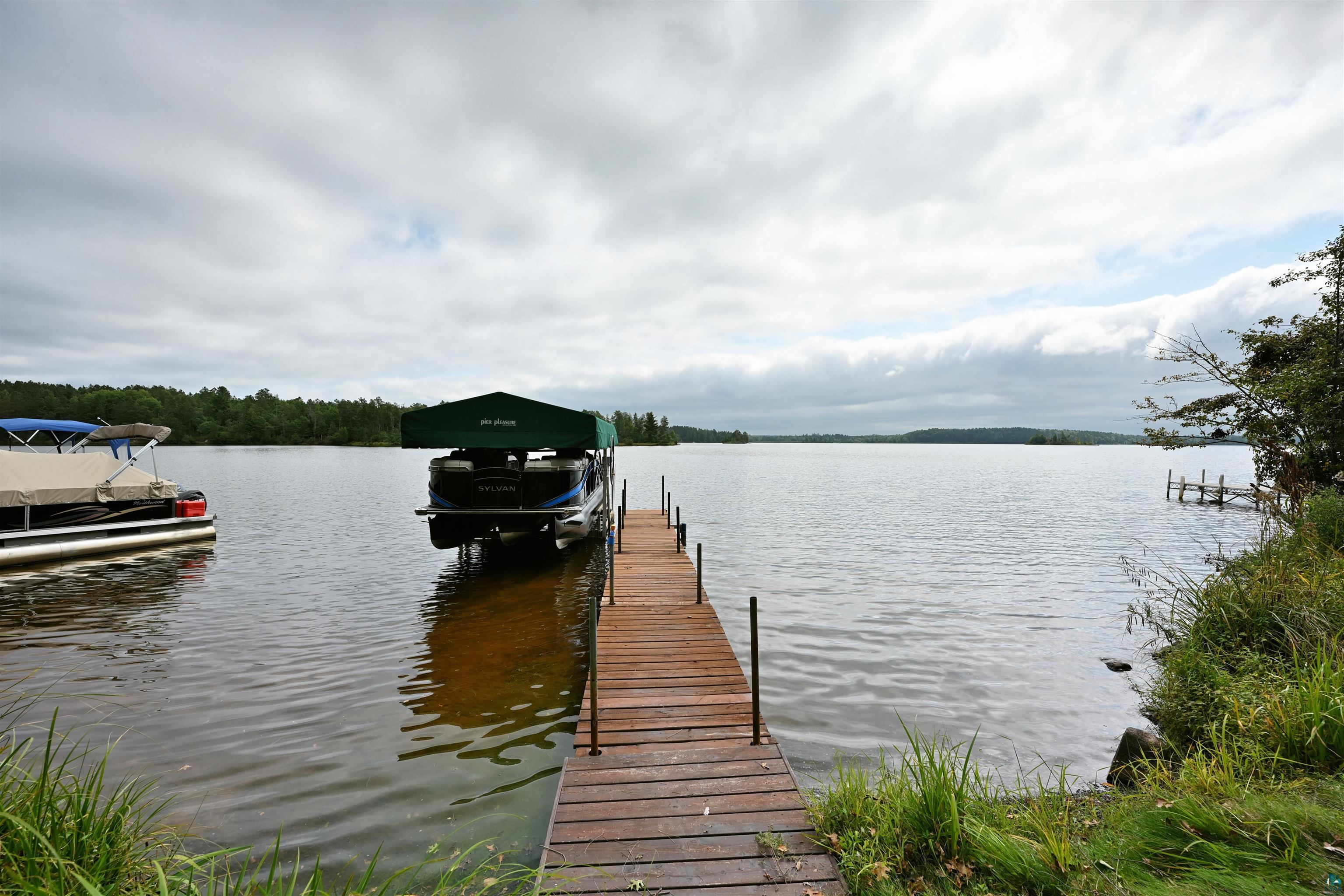 6833 View Point Lodge Road, Unit 13 Gordon, WI 54838 - Photo 25 of 32 Dock with a water view and boat lift
