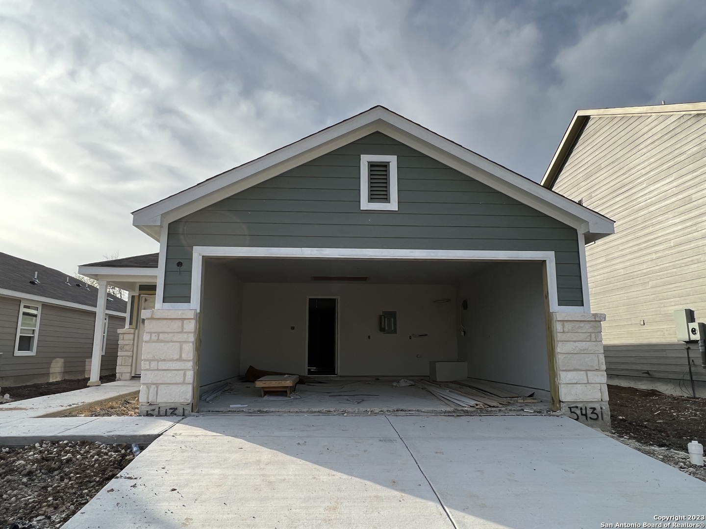 a front view of a house with garage