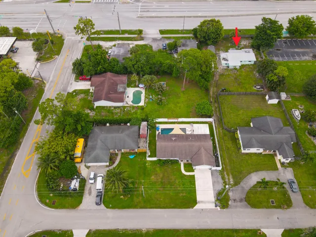 an aerial view of house with a yard