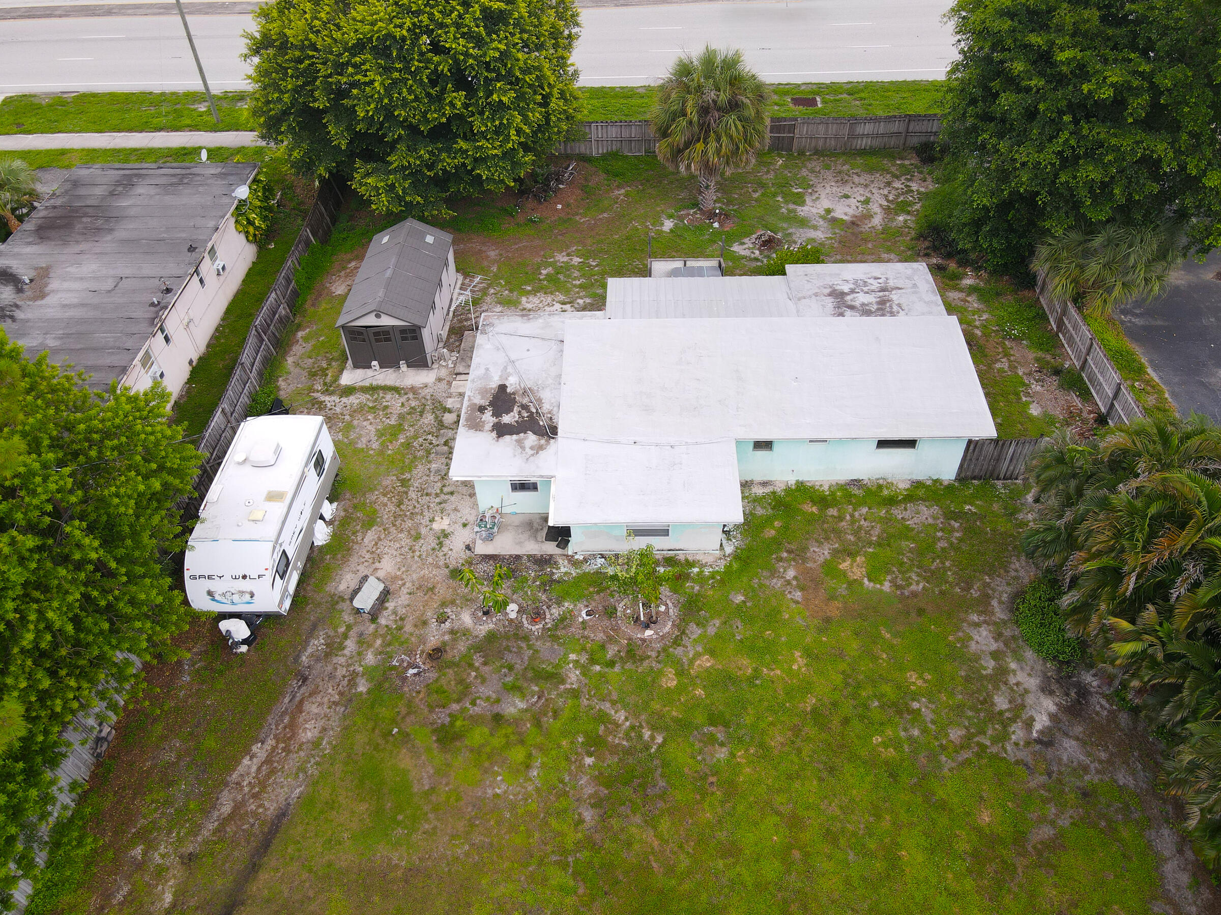 122 Springdale Road Lake Worth, FL 33467 - Photo 6 of 16 an aerial view of a house with a yard basket ball court and outdoor seating
