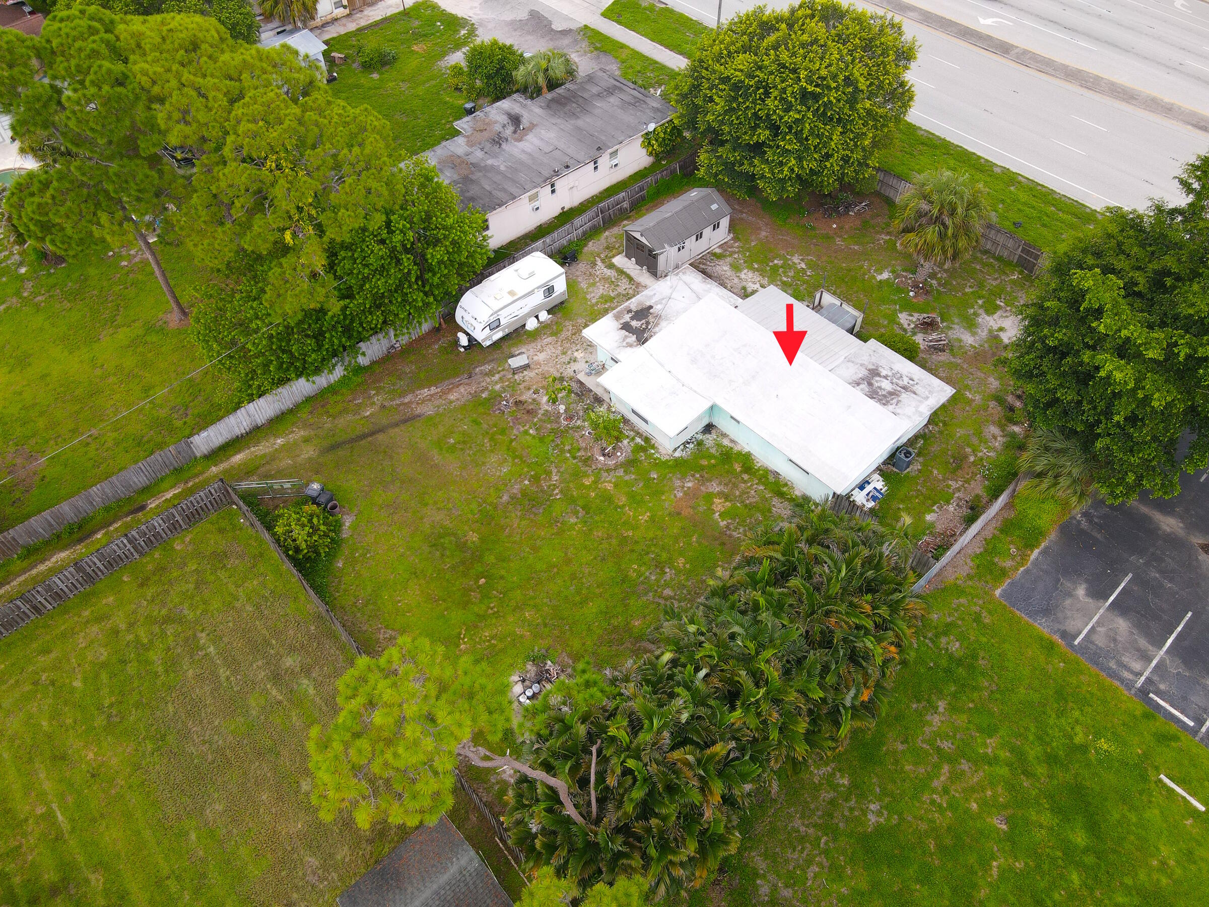122 Springdale Road Lake Worth, FL 33467 - Photo 7 of 16 an aerial view of residential house with pool and yard