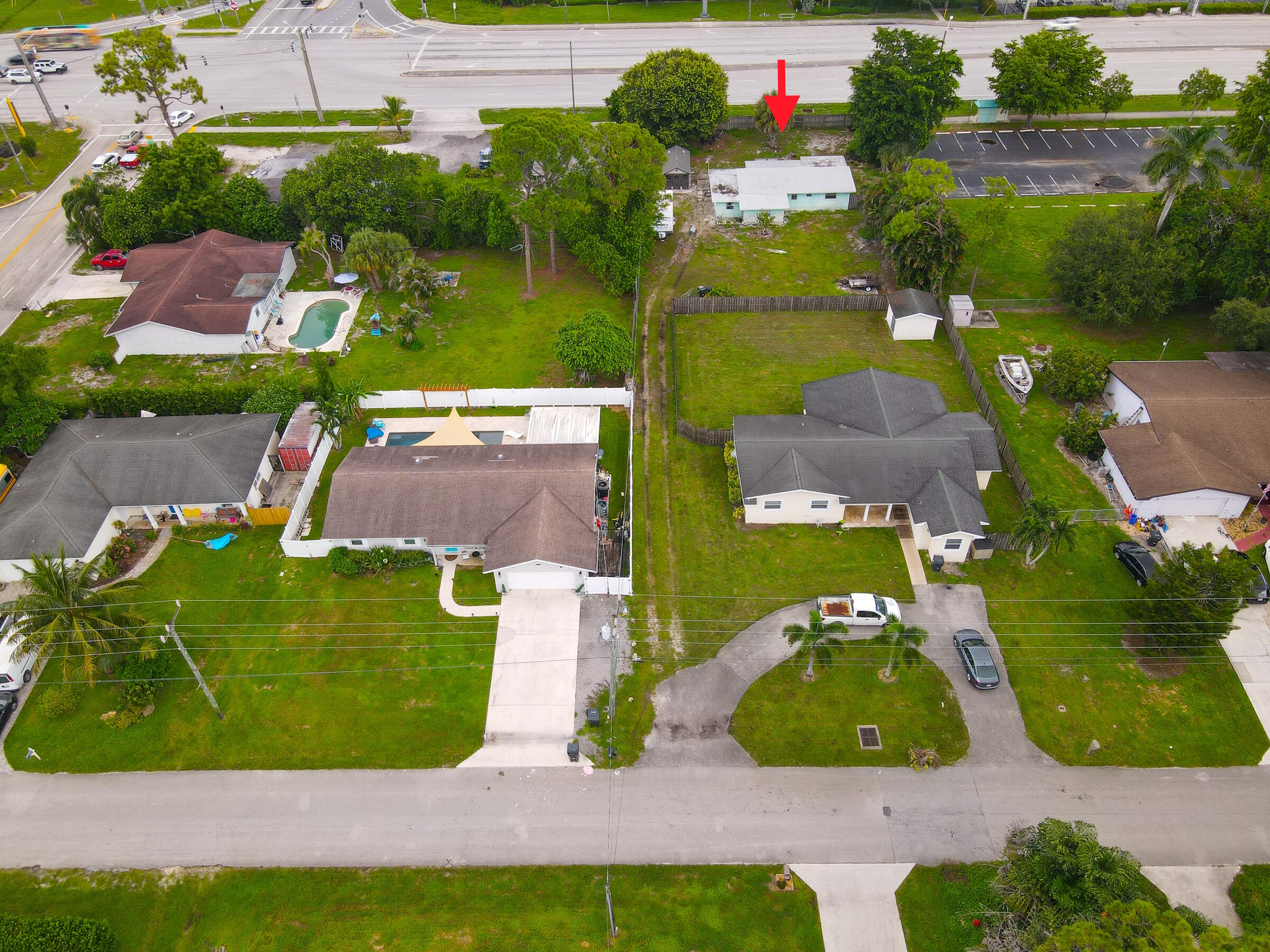 122 Springdale Road Lake Worth, FL 33467 - Photo 10 of 16 an aerial view of a house with a garden