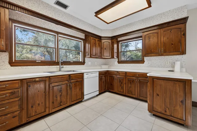 a bathroom with a toilet a sink and a shower