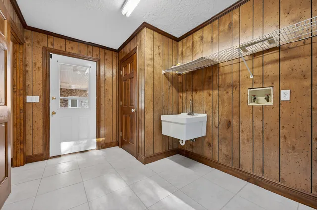 a spacious bathroom with a granite countertop sink mirror and a