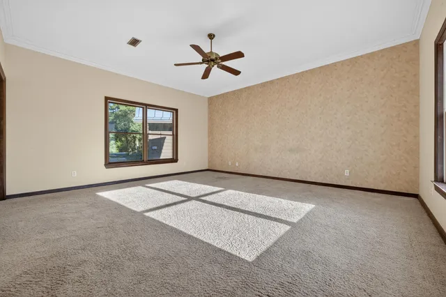 a bathroom with a granite countertop sink a large mirror and a