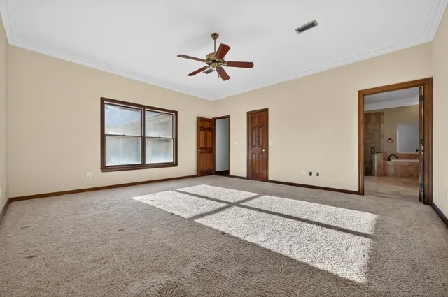 a view of staircase with wooden floor and white walls