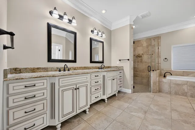 an empty room with windows and ceiling fan view