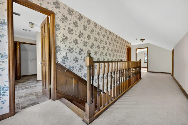 a living room with furniture and a gym machine