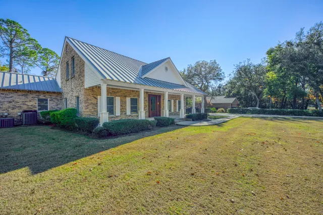 a view of swimming pool with deck and garden