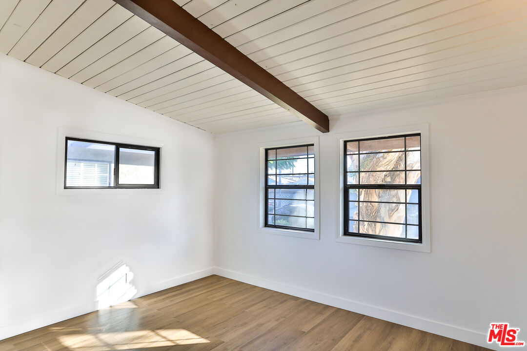 20341 Enadia Way Winnetka, CA 91306 - Photo 15 of 23 a view of empty room with wooden floor