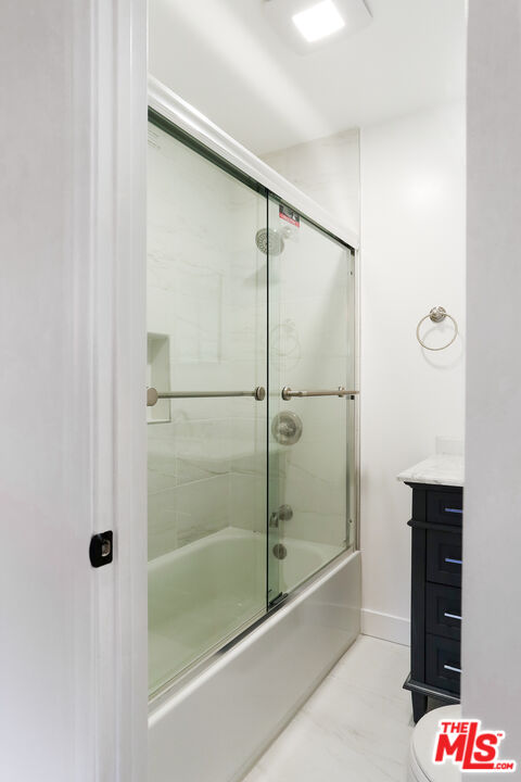 20341 Enadia Way Winnetka, CA 91306 - Photo 19 of 23 a bathroom with a bathtub and a shower