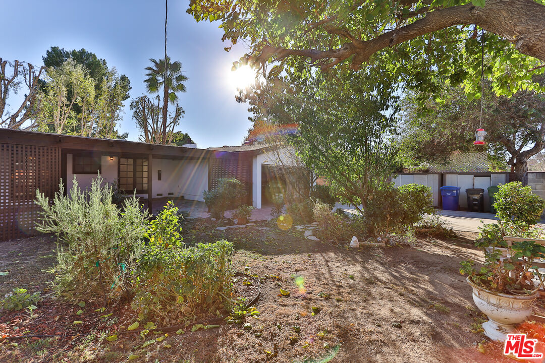 20341 Enadia Way Winnetka, CA 91306 - Photo 21 of 23 a view of a house with a tree in the background