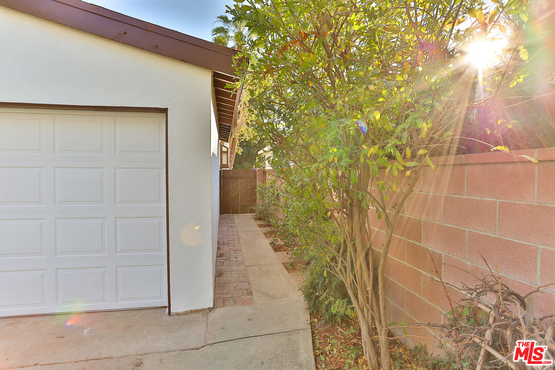20341 Enadia Way Winnetka, CA 91306 - Photo 22 of 23 a bathroom with a shower and a sink