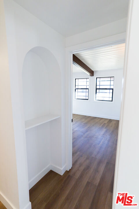 20341 Enadia Way Winnetka, CA 91306 - Photo 9 of 23 an empty room with wooden floor and windows