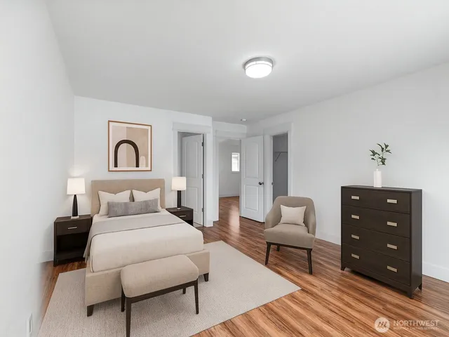 a bedroom with a bed and a couch