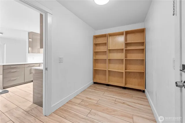 a view of a room with wooden floor and closet
