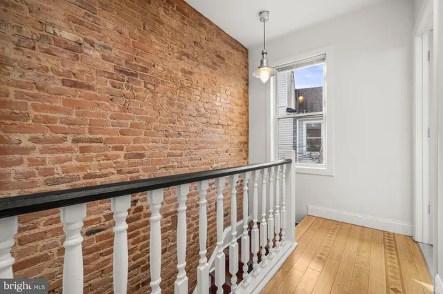 a view of balcony with wooden floor