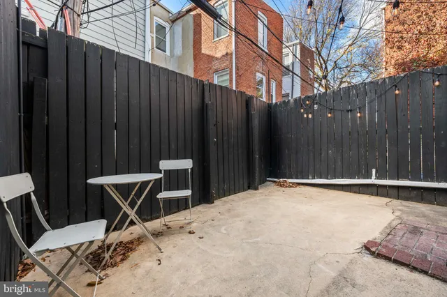 a view of outdoor space with wooden floor