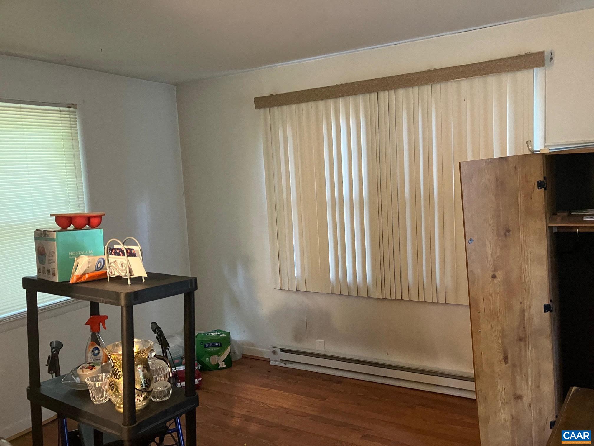 8203 Chestnut Grove Road Esmont, VA 22937 - Photo 7 of 13 a view of a room with furniture and wooden floor