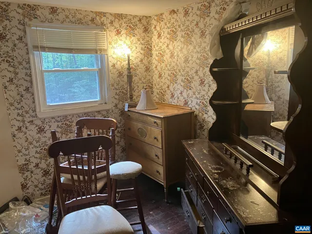 a table with chairs and a stove