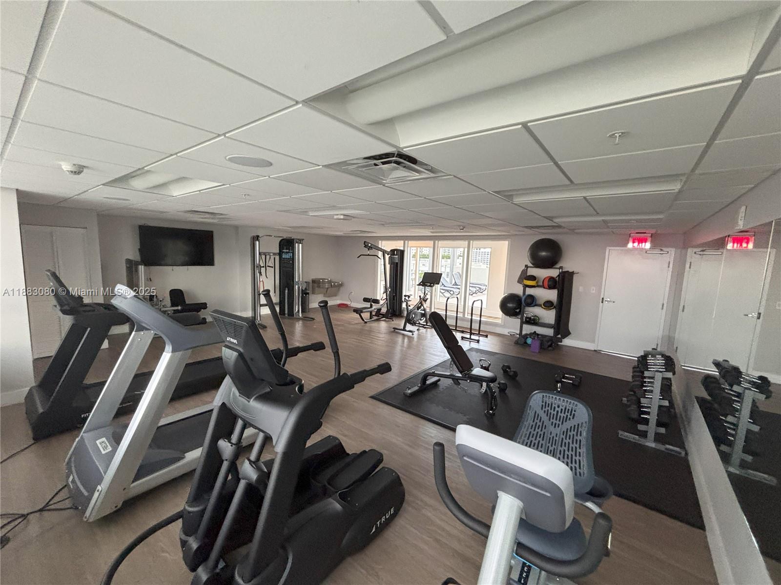 321 Northeast 26th Street, Unit 710 Miami, FL 33137 - Photo 12 of 21 a view of a room with gym equipment