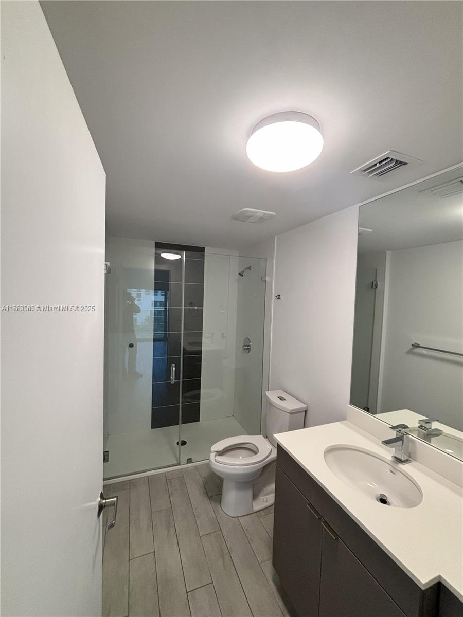 321 Northeast 26th Street, Unit 710 Miami, FL 33137 - Photo 20 of 21 a bathroom with a sink toilet and shower