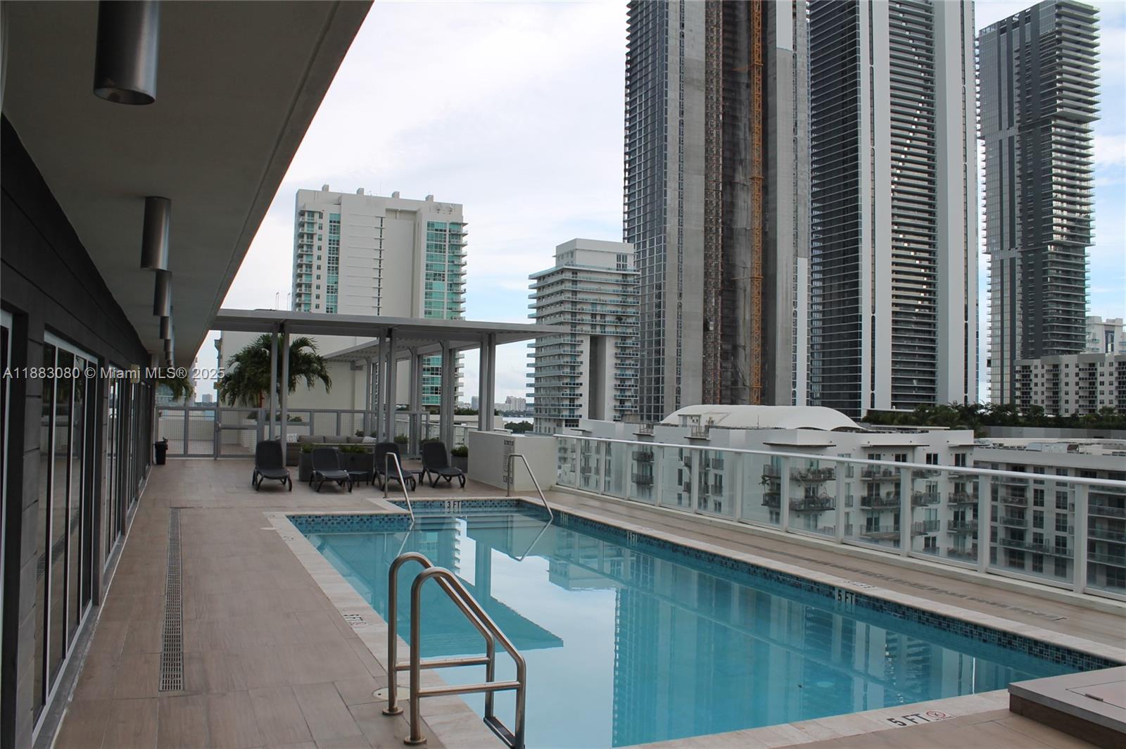 321 Northeast 26th Street, Unit 710 Miami, FL 33137 - Photo 3 of 21 a view of swimming pool with outdoor seating