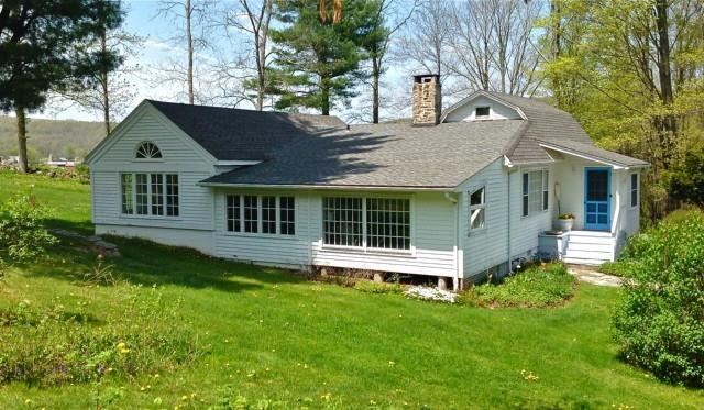 8 Rabbit Hill Road Warren, CT 06777 - Photo 1 of 1 a view of a house with a yard and sitting area
