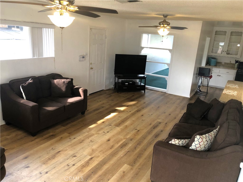 8808 Olive Street Bellflower, CA 90706 - Photo 17 of 42 Family Room view Towards Extra Exit Door & Dining Area