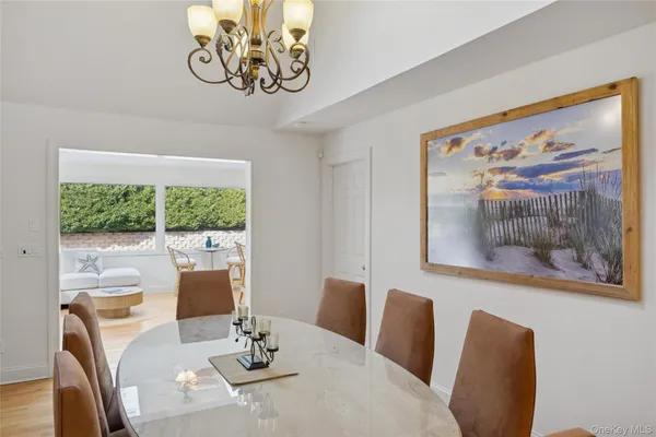 a dining room with furniture and window