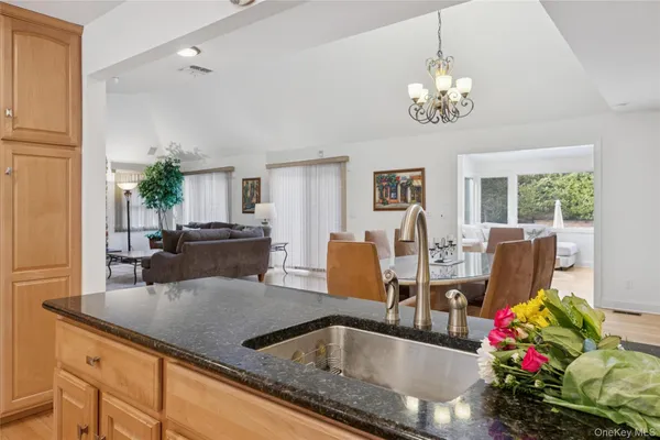 a view of kitchen dining table and chairs