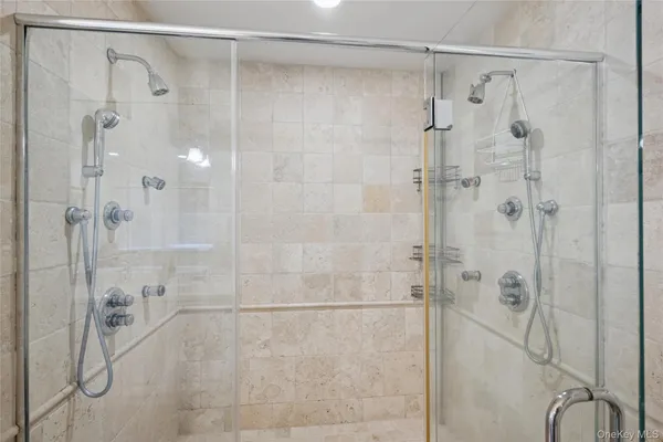 a bathroom with a glass shower door
