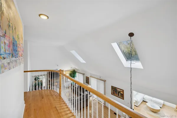 a view of a hallway with furniture