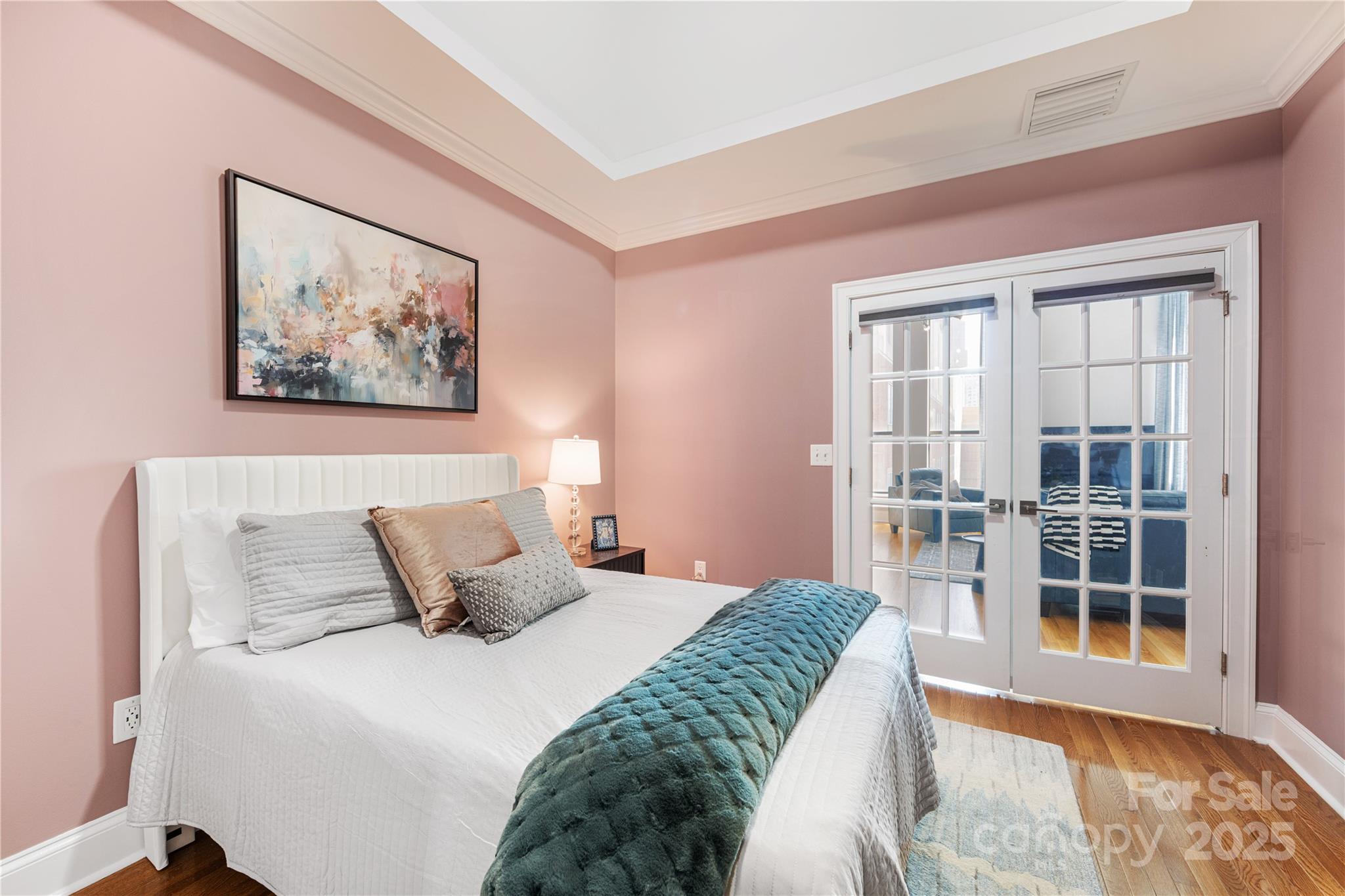 127 North Tryon Street, Unit 511 Charlotte, NC 28246 - Photo 22 of 32 a bedroom with a large bed and a window
