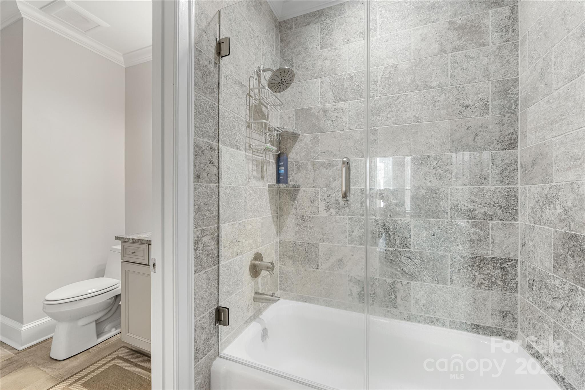 127 North Tryon Street, Unit 511 Charlotte, NC 28246 - Photo 26 of 32 a bathroom with a bathtub and a toilet