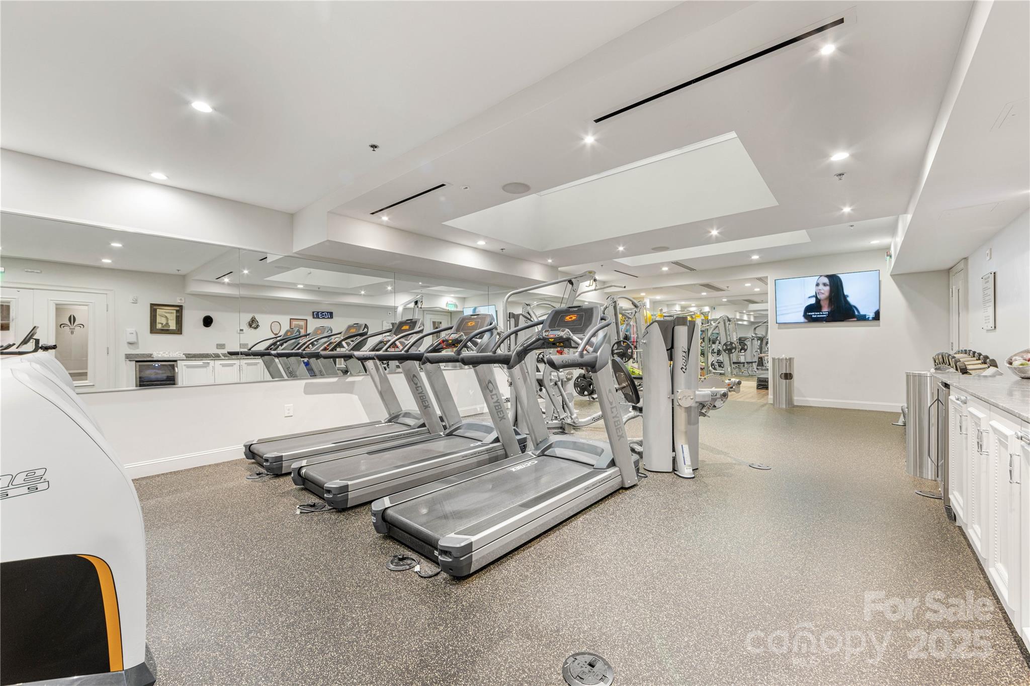 127 North Tryon Street, Unit 511 Charlotte, NC 28246 - Photo 28 of 32 a view of a room with gym equipment
