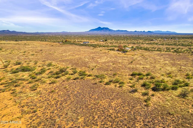 a view of an ocean and a mountain