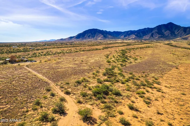 a view of an ocean and a mountain