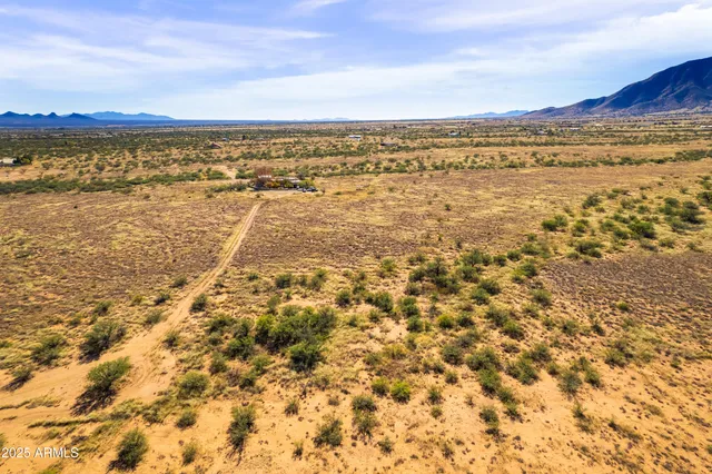a view of a large swimming pool and an outdoor seating