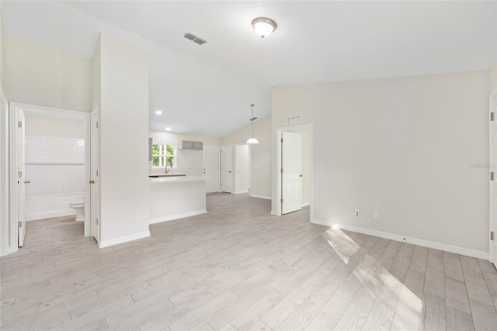 358 Locust Road Ocala, FL 34472 - Photo 12 of 48 wooden floor in an empty room with a window