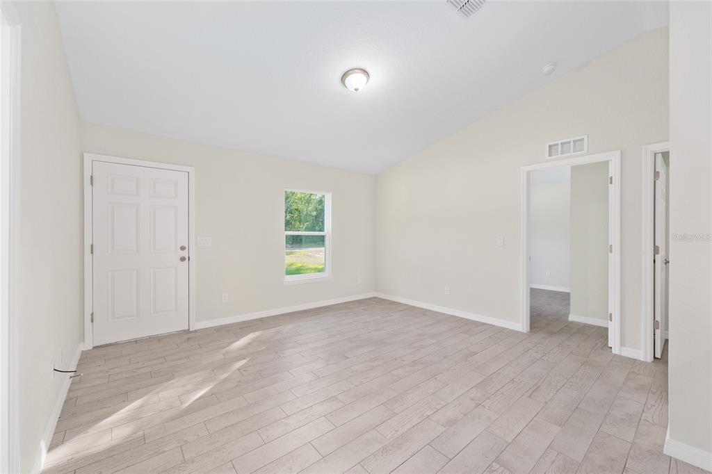 358 Locust Road Ocala, FL 34472 - Photo 14 of 48 a view of an empty room with a window