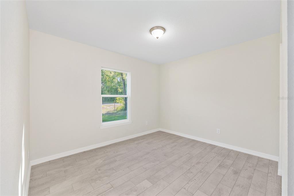 358 Locust Road Ocala, FL 34472 - Photo 25 of 48 an empty room with a window