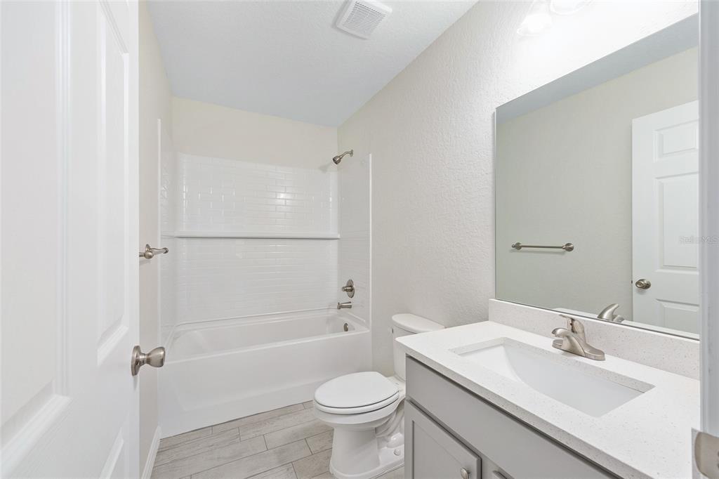 358 Locust Road Ocala, FL 34472 - Photo 27 of 48 a bathroom with a sink a toilet and shower