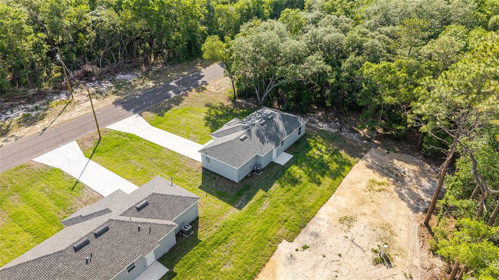 358 Locust Road Ocala, FL 34472 - Photo 42 of 48 an aerial view of a house with a yard basket ball court