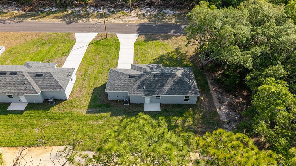 358 Locust Road Ocala, FL 34472 - Photo 44 of 48 a view of a swimming pool with a garden