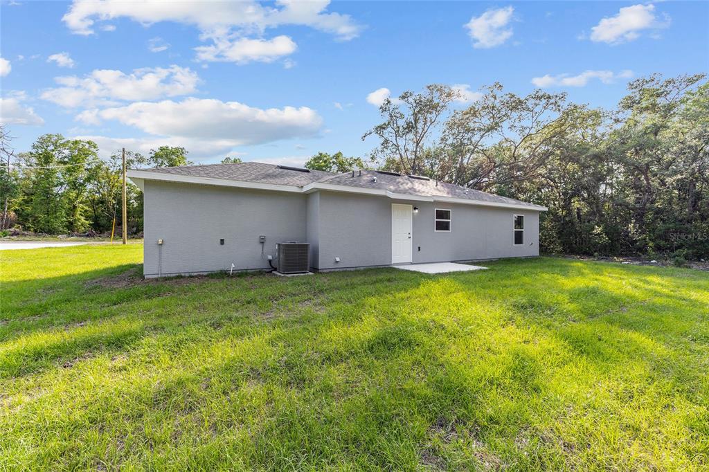 358 Locust Road Ocala, FL 34472 - Photo 6 of 48 a view of a house with backyard and garden