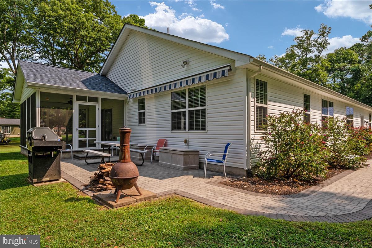 115 Rebel Road Grasonville, MD 21638 - Photo 12 of 37 Retractable awning shades the Patio area